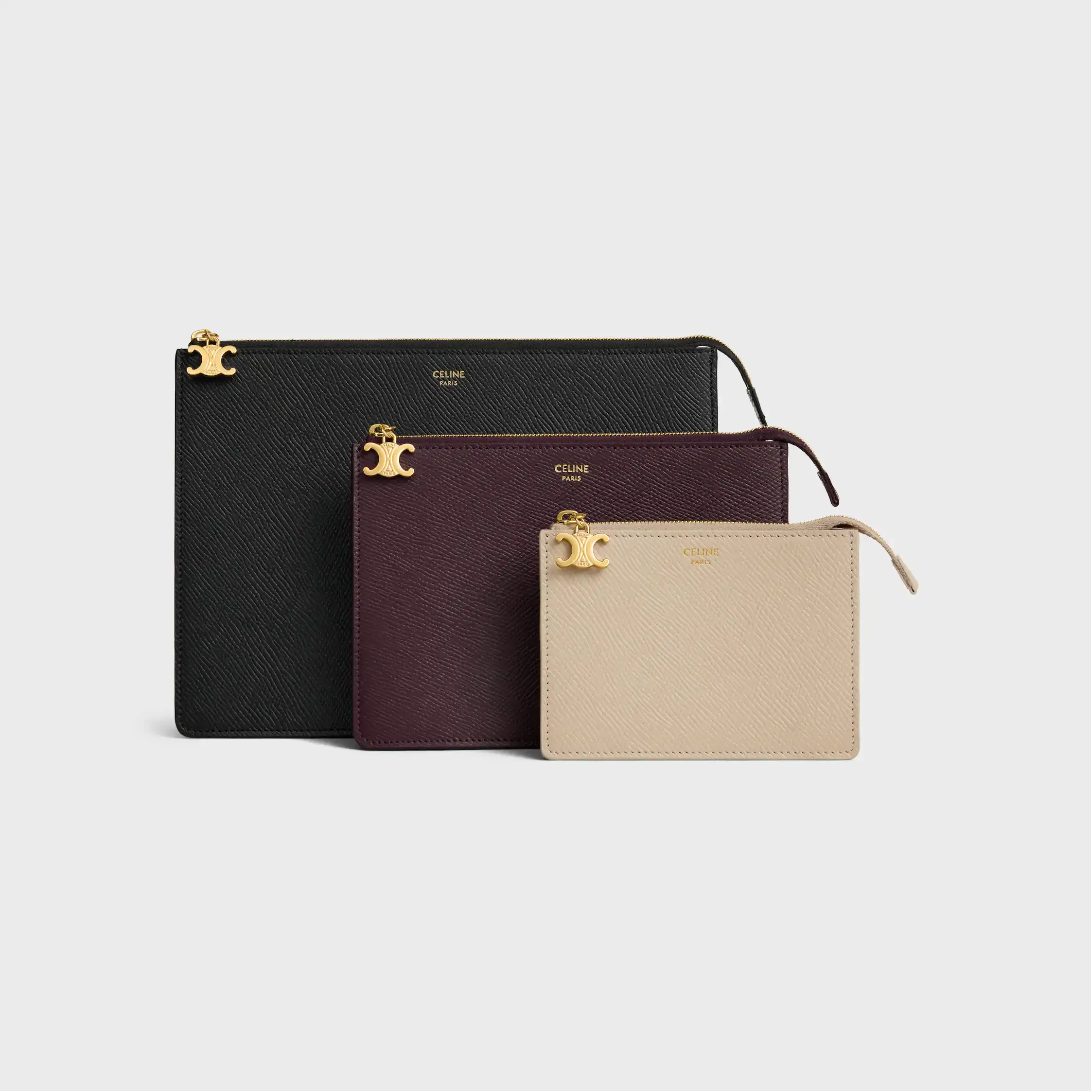 ENSEMBLE DE TROIS POCHETTES EN CUIR DE VEAU GRAINÉ TRIO