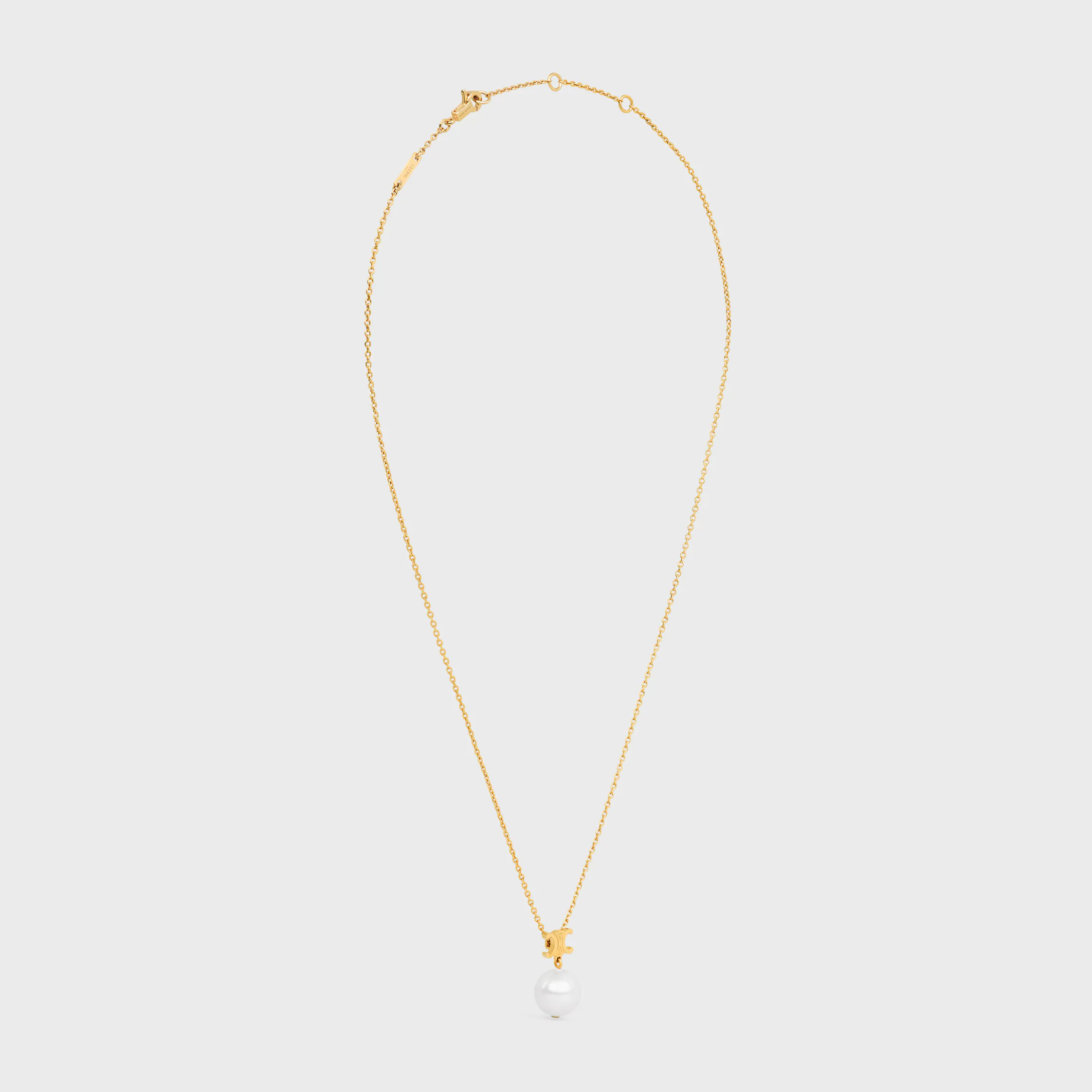 Le collier Les Perles Celine en perle de résine et laiton avec finition or