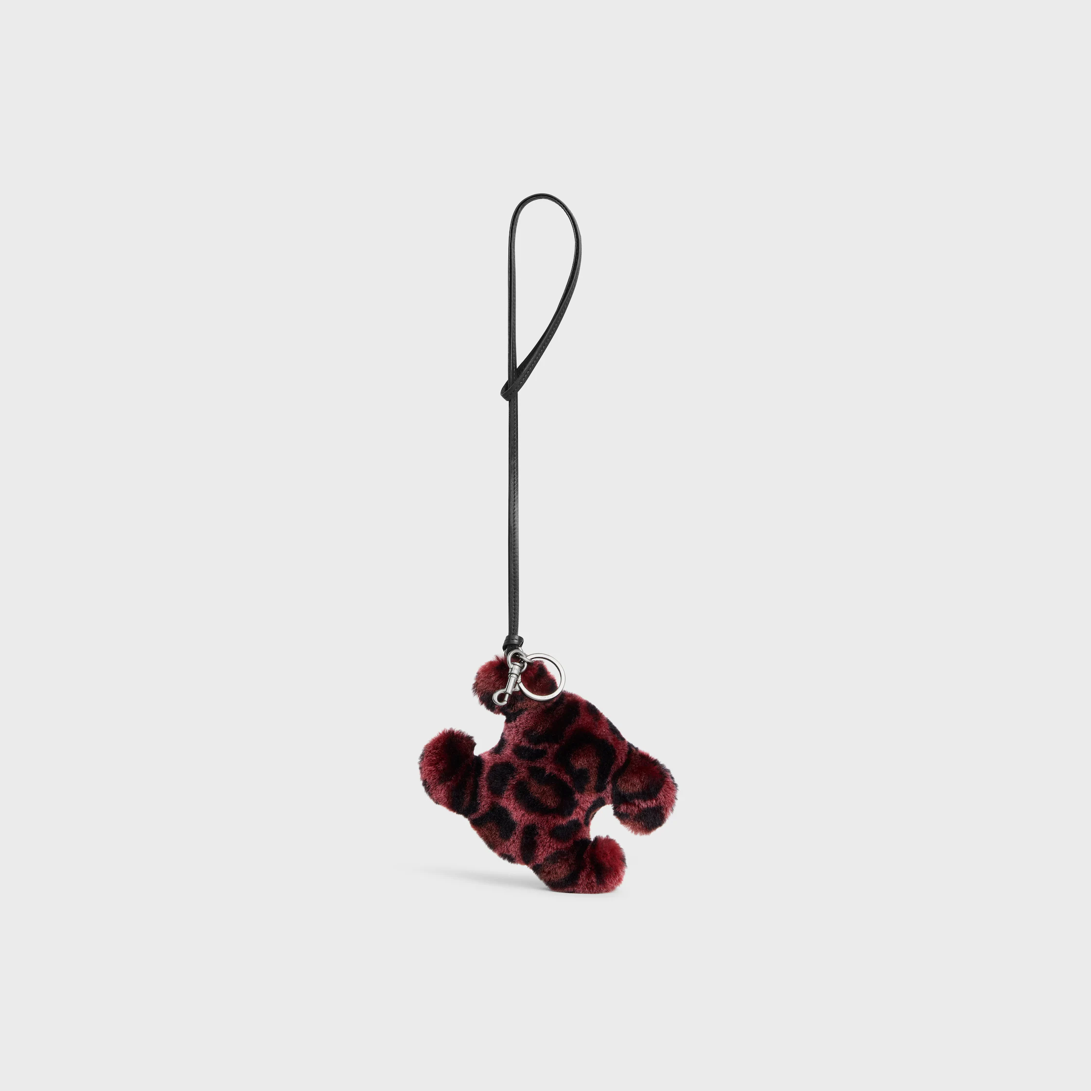 TRIOMPHE POM-POM AMULETE EN PEAU DE MOUTON ET VEAU