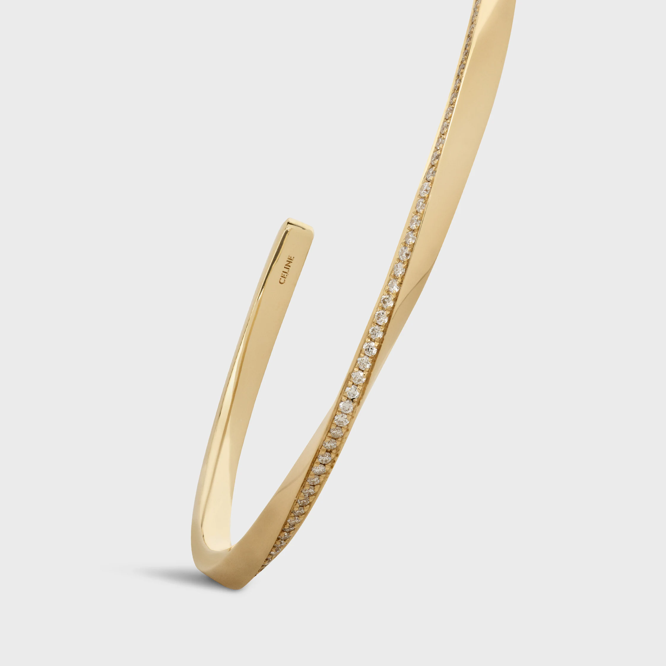 Bracelet torsion en or jaune et diamants