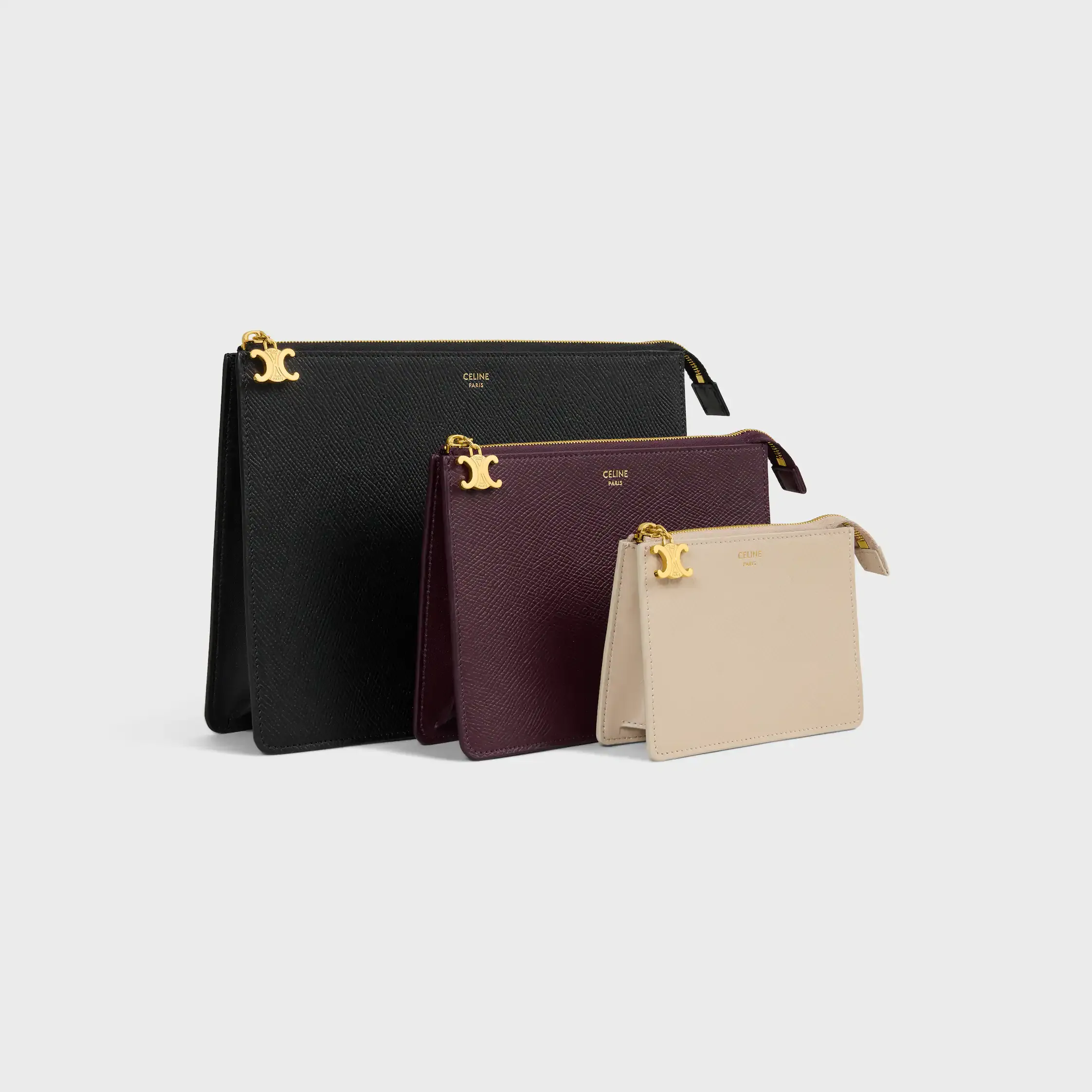 ENSEMBLE DE TROIS POCHETTES EN CUIR DE VEAU GRAINÉ TRIO