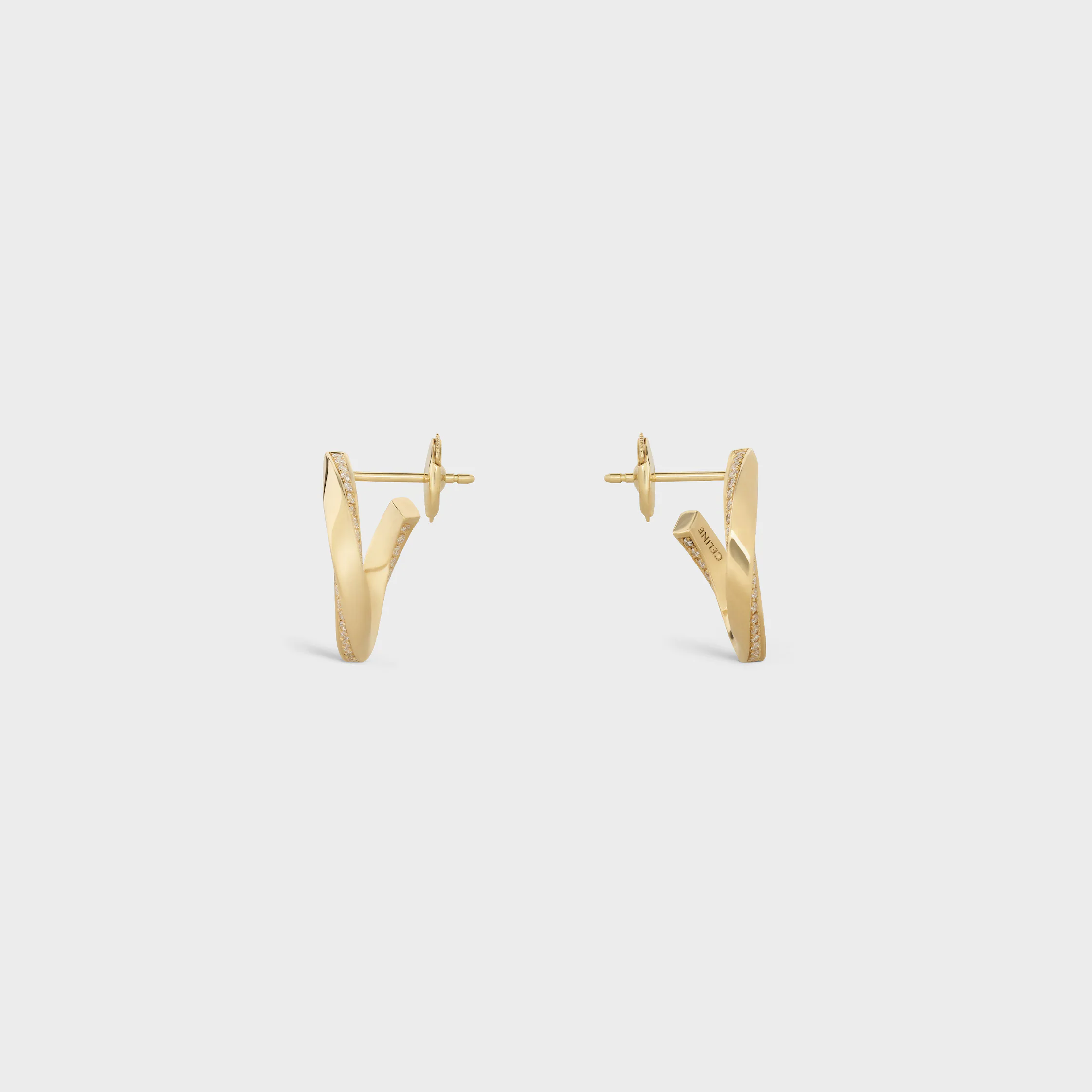 Boucles d'oreilles torsion en or jaune et diamants